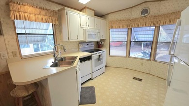 TURNKEY MOBILE HOME IN ACTIVE 55+ COMMUNITY! This one bedroom, 1 on River Run Golf Links in Florida - for sale on GolfHomes.com, golf home, golf lot