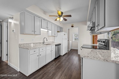 What a deal! Welcome to this 3-bedroom, 2-bath contemporary on Harbour Point Golf Club in North Carolina - for sale on GolfHomes.com, golf home, golf lot