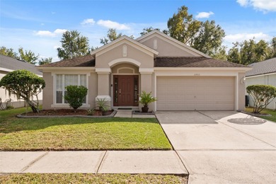 Discover this beautifully updated 4-bedroom, 2-bath home with a on Lexington Oaks Golf Club in Florida - for sale on GolfHomes.com, golf home, golf lot