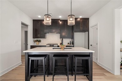 Discover modern, low-maintenance luxury living in this stunning on The Golf Club of Kansas in Kansas - for sale on GolfHomes.com, golf home, golf lot