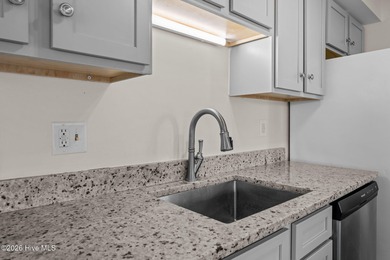 What a deal! Welcome to this 3-bedroom, 2-bath contemporary on Harbour Point Golf Club in North Carolina - for sale on GolfHomes.com, golf home, golf lot