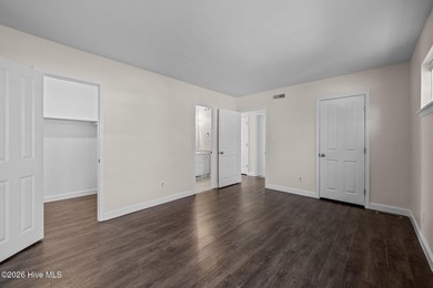 What a deal! Welcome to this 3-bedroom, 2-bath contemporary on Harbour Point Golf Club in North Carolina - for sale on GolfHomes.com, golf home, golf lot