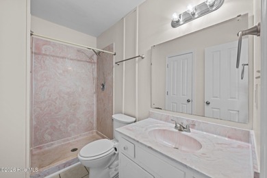 What a deal! Welcome to this 3-bedroom, 2-bath contemporary on Harbour Point Golf Club in North Carolina - for sale on GolfHomes.com, golf home, golf lot