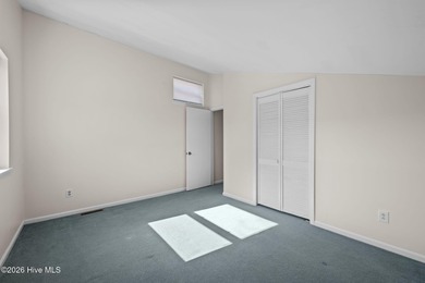 What a deal! Welcome to this 3-bedroom, 2-bath contemporary on Harbour Point Golf Club in North Carolina - for sale on GolfHomes.com, golf home, golf lot