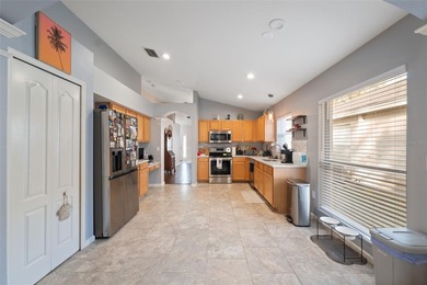 Discover this beautifully updated 4-bedroom, 2-bath home with a on Lexington Oaks Golf Club in Florida - for sale on GolfHomes.com, golf home, golf lot