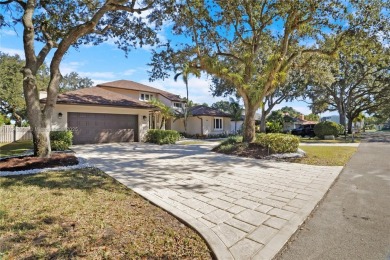Welcome to this 5BR/4BA custom home on a quiet cul-de-sac with on Jacaranda Golf Club in Florida - for sale on GolfHomes.com, golf home, golf lot