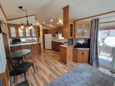 WATER VIEWS FROM YOUR LIVING ROOM!  Unusual park model; the on Cascade Golf Course in Idaho - for sale on GolfHomes.com, golf home, golf lot