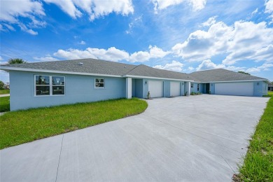 This nearly completed WATERFRONT TRIPLEX in Rotonda West, FL, is on Rotonda Golf and Country Club The Palms Course in Florida - for sale on GolfHomes.com, golf home, golf lot