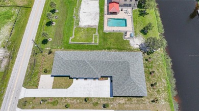 This nearly completed WATERFRONT TRIPLEX in Rotonda West, FL, is on Rotonda Golf and Country Club The Palms Course in Florida - for sale on GolfHomes.com, golf home, golf lot