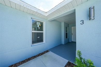 This nearly completed WATERFRONT TRIPLEX in Rotonda West, FL, is on Rotonda Golf and Country Club The Palms Course in Florida - for sale on GolfHomes.com, golf home, golf lot