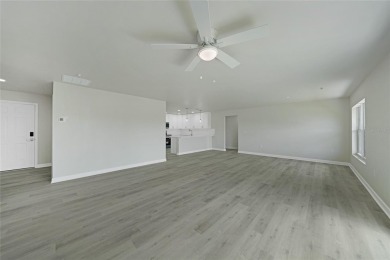 This nearly completed WATERFRONT TRIPLEX in Rotonda West, FL, is on Rotonda Golf and Country Club The Palms Course in Florida - for sale on GolfHomes.com, golf home, golf lot