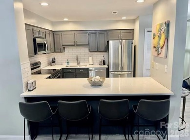 GREAT RENTAL HISTORY on this recently renovated townhome with a on Rumbling Bald Resort on Lake Lure in North Carolina - for sale on GolfHomes.com, golf home, golf lot