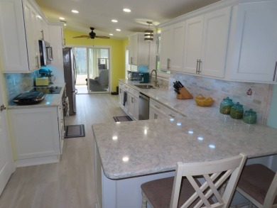 Watch the sunrise or just relax in your glass enclosed 4 season on Crane Lakes Golf and Country Club in Florida - for sale on GolfHomes.com, golf home, golf lot