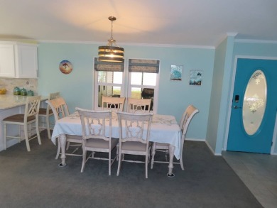 Watch the sunrise or just relax in your glass enclosed 4 season on Crane Lakes Golf and Country Club in Florida - for sale on GolfHomes.com, golf home, golf lot