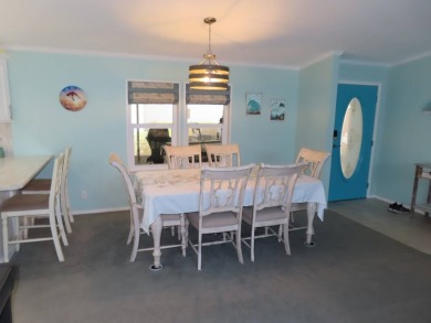 Watch the sunrise or just relax in your glass enclosed 4 season on Crane Lakes Golf and Country Club in Florida - for sale on GolfHomes.com, golf home, golf lot