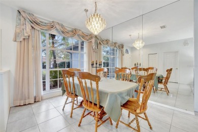 This beautifully maintained 4-bedroom home has been lovingly on Hunters Green Country Club in Florida - for sale on GolfHomes.com, golf home, golf lot