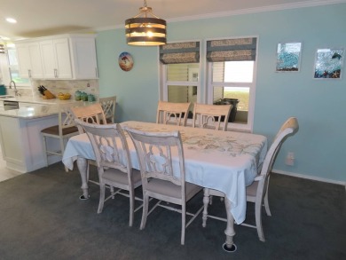 Watch the sunrise or just relax in your glass enclosed 4 season on Crane Lakes Golf and Country Club in Florida - for sale on GolfHomes.com, golf home, golf lot