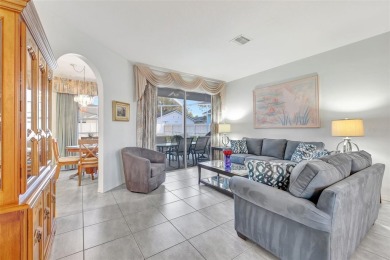 This beautifully maintained 4-bedroom home has been lovingly on Hunters Green Country Club in Florida - for sale on GolfHomes.com, golf home, golf lot