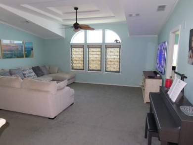Watch the sunrise or just relax in your glass enclosed 4 season on Crane Lakes Golf and Country Club in Florida - for sale on GolfHomes.com, golf home, golf lot