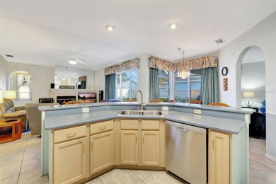 This beautifully maintained 4-bedroom home has been lovingly on Hunters Green Country Club in Florida - for sale on GolfHomes.com, golf home, golf lot