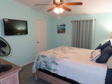 Watch the sunrise or just relax in your glass enclosed 4 season on Crane Lakes Golf and Country Club in Florida - for sale on GolfHomes.com, golf home, golf lot