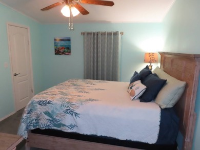 Watch the sunrise or just relax in your glass enclosed 4 season on Crane Lakes Golf and Country Club in Florida - for sale on GolfHomes.com, golf home, golf lot