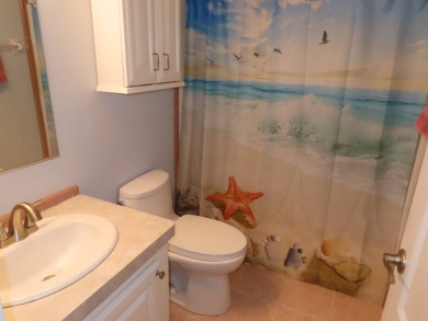Watch the sunrise or just relax in your glass enclosed 4 season on Crane Lakes Golf and Country Club in Florida - for sale on GolfHomes.com, golf home, golf lot