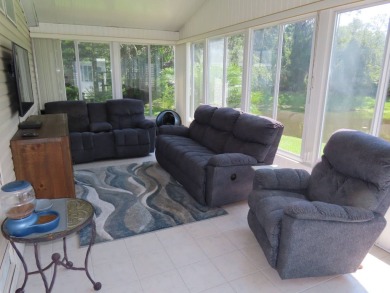 Watch the sunrise or just relax in your glass enclosed 4 season on Crane Lakes Golf and Country Club in Florida - for sale on GolfHomes.com, golf home, golf lot