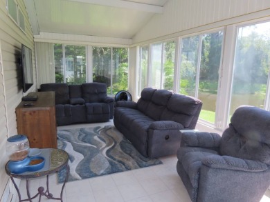 Watch the sunrise or just relax in your glass enclosed 4 season on Crane Lakes Golf and Country Club in Florida - for sale on GolfHomes.com, golf home, golf lot