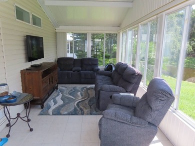 Watch the sunrise or just relax in your glass enclosed 4 season on Crane Lakes Golf and Country Club in Florida - for sale on GolfHomes.com, golf home, golf lot