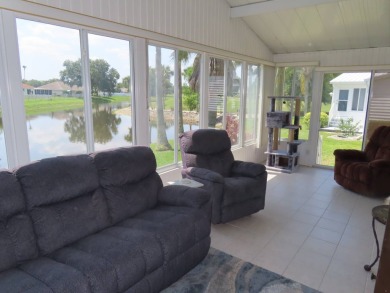 Watch the sunrise or just relax in your glass enclosed 4 season on Crane Lakes Golf and Country Club in Florida - for sale on GolfHomes.com, golf home, golf lot