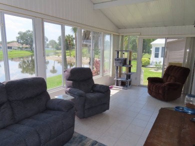 Watch the sunrise or just relax in your glass enclosed 4 season on Crane Lakes Golf and Country Club in Florida - for sale on GolfHomes.com, golf home, golf lot