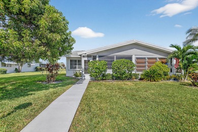 Lake & fountain views from both bedrooms & patio. Front patio & on Cypress Lakes Golf Course - West Palm Beach in Florida - for sale on GolfHomes.com, golf home, golf lot