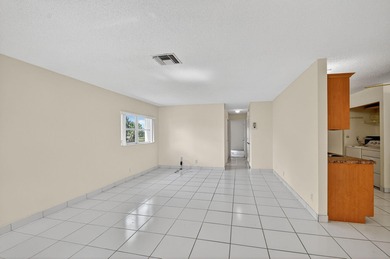 Lake & fountain views from both bedrooms & patio. Front patio & on Cypress Lakes Golf Course - West Palm Beach in Florida - for sale on GolfHomes.com, golf home, golf lot