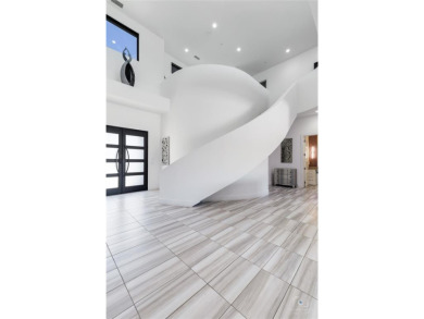 This ultra-modern smart home, on a rare double golf course lot on The Trails of Frisco Golf Club in Texas - for sale on GolfHomes.com, golf home, golf lot