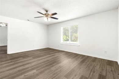 This remodeled 3-bedroom, 2-bath brick home is centrally located on Lake Forest Yacht and Country Club in Alabama - for sale on GolfHomes.com, golf home, golf lot