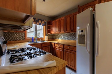 OPEN HOUSE  5/3/25 10AM-1PM Welcome to 6456 Wilderness Drive on Lakes of the North Deer Run Golf Course in Michigan - for sale on GolfHomes.com, golf home, golf lot