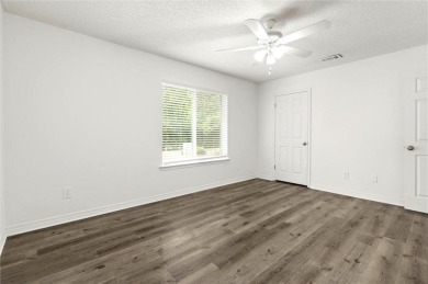 This remodeled 3-bedroom, 2-bath brick home is centrally located on Lake Forest Yacht and Country Club in Alabama - for sale on GolfHomes.com, golf home, golf lot