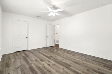 This remodeled 3-bedroom, 2-bath brick home is centrally located on Lake Forest Yacht and Country Club in Alabama - for sale on GolfHomes.com, golf home, golf lot