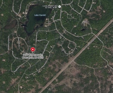 OPEN HOUSE  5/3/25 10AM-1PM Welcome to 6456 Wilderness Drive on Lakes of the North Deer Run Golf Course in Michigan - for sale on GolfHomes.com, golf home, golf lot