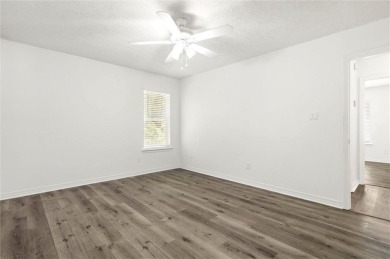 This remodeled 3-bedroom, 2-bath brick home is centrally located on Lake Forest Yacht and Country Club in Alabama - for sale on GolfHomes.com, golf home, golf lot