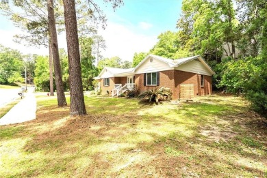 This remodeled 3-bedroom, 2-bath brick home is centrally located on Lake Forest Yacht and Country Club in Alabama - for sale on GolfHomes.com, golf home, golf lot