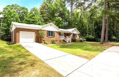 This remodeled 3-bedroom, 2-bath brick home is centrally located on Lake Forest Yacht and Country Club in Alabama - for sale on GolfHomes.com, golf home, golf lot