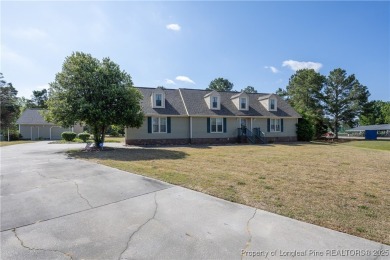 Welcome to this charming 3-bedroom, 2.5-bath home on Hole One of on Sandy Ridge Country Club in North Carolina - for sale on GolfHomes.com, golf home, golf lot