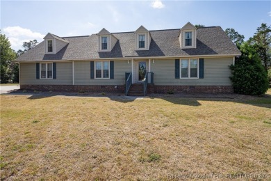 Welcome to this charming 3-bedroom, 2.5-bath home on Hole One of on Sandy Ridge Country Club in North Carolina - for sale on GolfHomes.com, golf home, golf lot