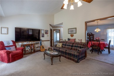 Welcome to this charming 3-bedroom, 2.5-bath home on Hole One of on Sandy Ridge Country Club in North Carolina - for sale on GolfHomes.com, golf home, golf lot