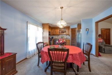 Welcome to this charming 3-bedroom, 2.5-bath home on Hole One of on Sandy Ridge Country Club in North Carolina - for sale on GolfHomes.com, golf home, golf lot