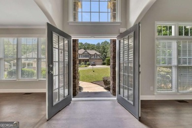 Spacious home nestled in the sought-after Bridgemill community on Bridgemill Golf Club in Georgia - for sale on GolfHomes.com, golf home, golf lot
