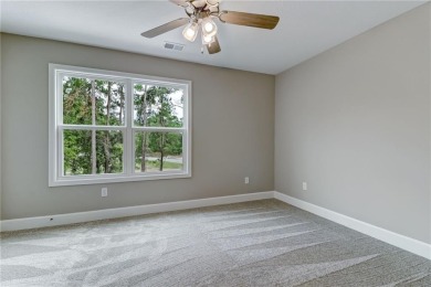This stunning two-story home by renowned local builder Josselyn on Laurel Island Links in Georgia - for sale on GolfHomes.com, golf home, golf lot