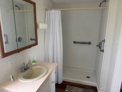 Welcome home to this lovely 2-bedroom, 2-bath oasis in the 55+ on Lake Henry Golf Club in Florida - for sale on GolfHomes.com, golf home, golf lot
